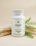 Shatavari capsules bottle with green leaves and roots on a beige background